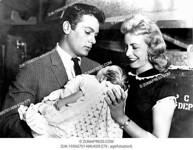 July 1, 1956 - Los Angeles, CA, U.S. - American actor TONY CURTIS and his first wife JANET LEIGH holding their daughter KELLY LEE CURTIS