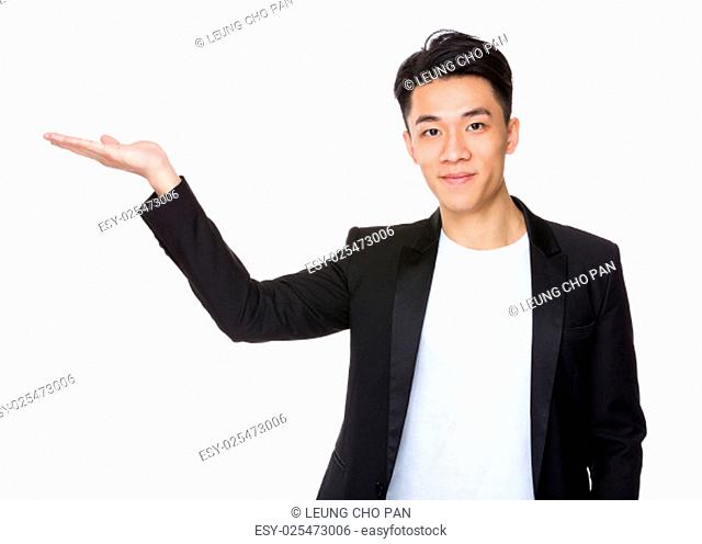 Asian young man with hand show with blank sign