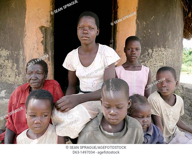 UGANDA    The work of Comboni Samaritans, Gulu  Visiting a child headed family  Aromorach Sharon is the oldest girl and looks after her 6 younger siblings and...