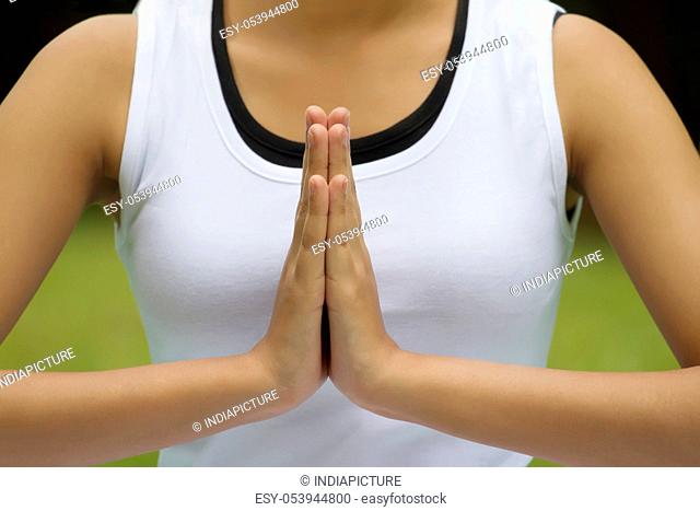 Close-up of woman's hands in prayer position