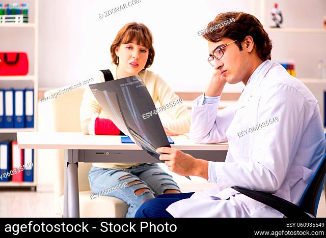 Young woman visiting doctor traumatologist