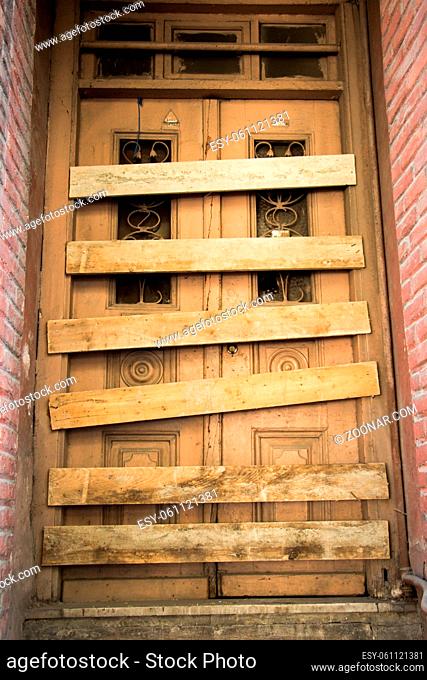 Old styled wooden door of an old building