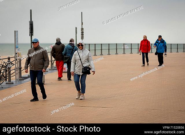 Illustration picture shows tourists in the rain during the summer holiday at the Belgian coast, in Oostende, on Wednesday 02 August 2023