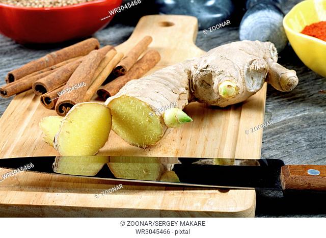 Kitchen knife ginger cinnamon on a chopping board