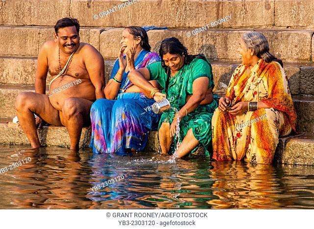Hindu Pilgrims Bathing In The Holy River Ganges, Varanasi, Uttar Pradesh, India