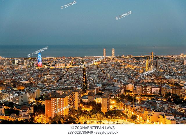 Barcelona at night seen from the Parc del Guinardó on top of a west side hill