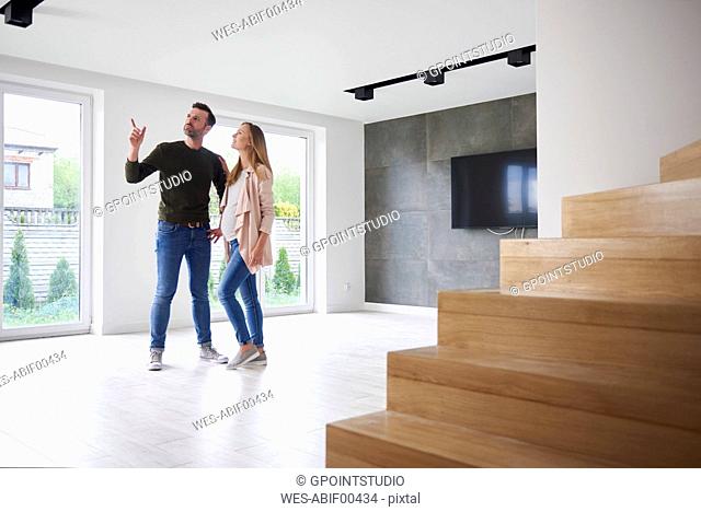 Couple looking around in empty flat