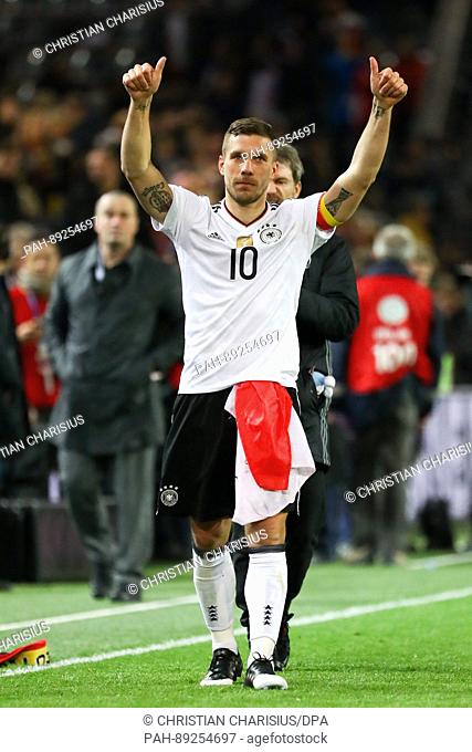 Germany's Lukas Podolski bids farewell to his fans after the international friendly soccer match between Germany and England at the Signal Iduna Park in...