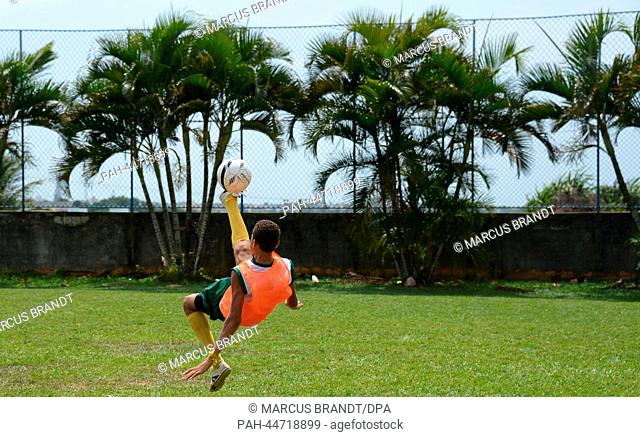 Brazilian youths in action during a practice session of the FIFA soccer project 'Football for Hope' in Salvadore, Brazil, 7 December 2013