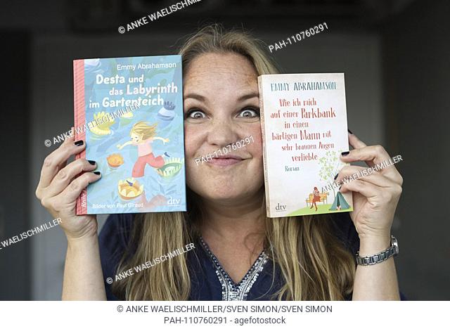 Emmy ABRAHAMSON, SWE, with her books ""How I fell in love with a bearded man with very brown eyes on a park bench"" and ""Desta and the Labyrinth in the garden...