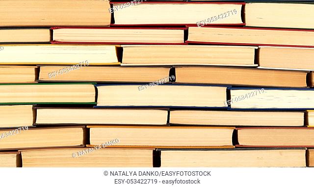 abstract texture from stacks of various hardback books, full frame, concept back to school