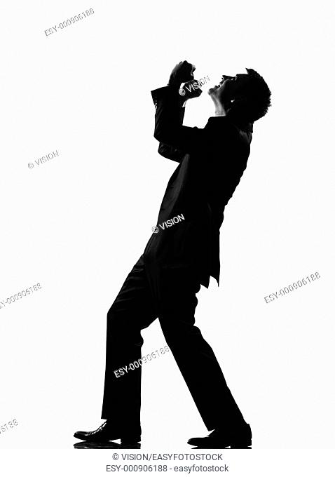 silhouette caucasian business man expressing anger adversity despair looking up behavior full length on studio isolated white background