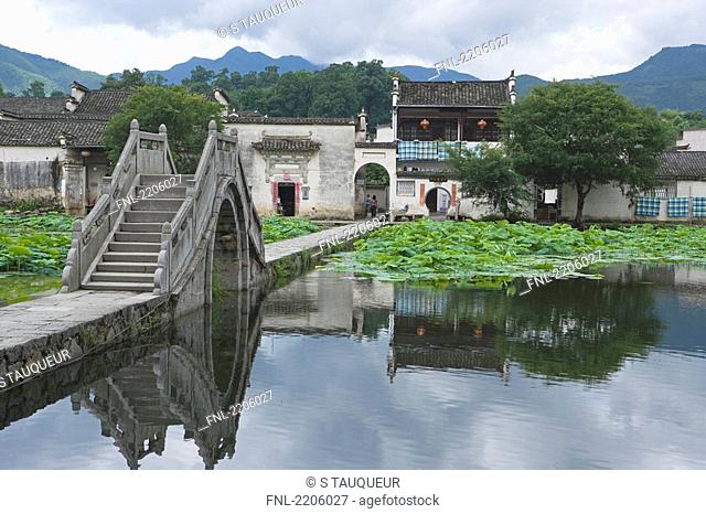 Bridge across pond, Hongcun, Anhui, China