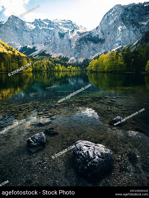 mountain lake hinterer langbathsee in upper austria during summer - clear alpine lake in salzkammergut
