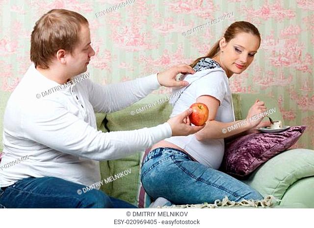 Pregnant family. Concept of healthy food