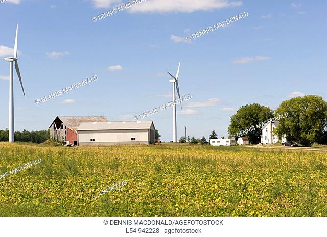 Agricultural Wind Farm farms turbine produces kinetic energy in wind into mechanical energy converting wind to electricity in Michigan near Ubly Michigan
