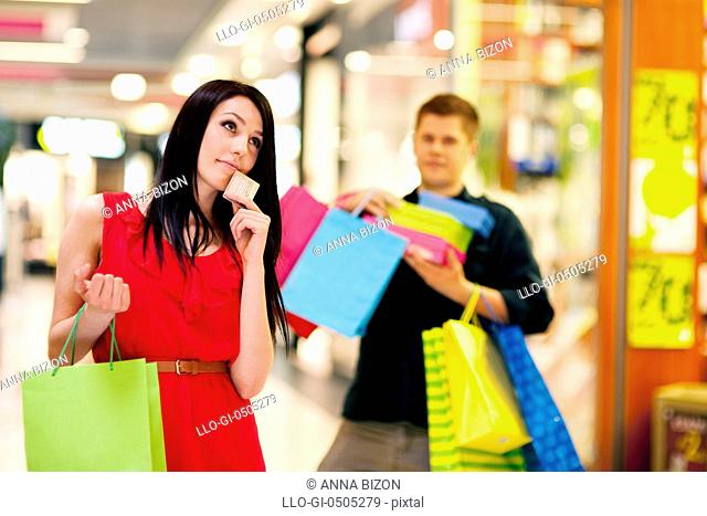 Young woman spending too much money for shopping. Debica, Poland