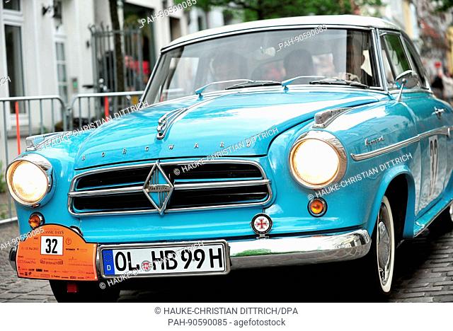 Participants start with a vintage car of type Borgward Isabella at the City Grand Prix in Oldenburg (Germany), 11 May 2012. | usage worldwide