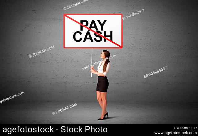 business person holding a traffic sign with PAY CASH inscription, new idea concept