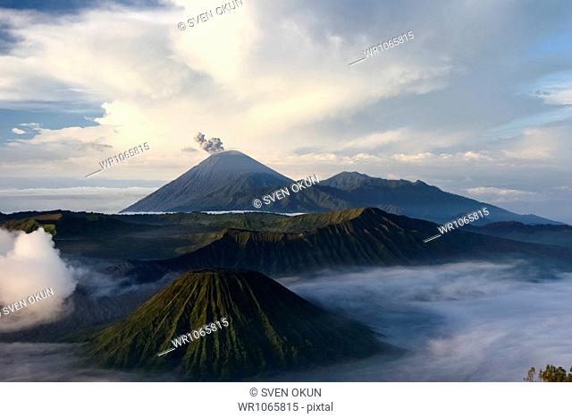 Active crater of Mount Bromo left, Mount Batok in front and behind it the Mount Semeru, Bromo Tengger Semeru National Park, Island of Java, Indonesia