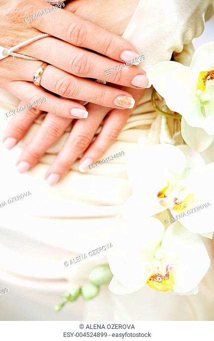 Bridal hands with wedding ring