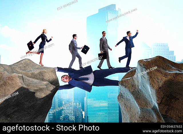 The businessman acting as a bridge in support concept