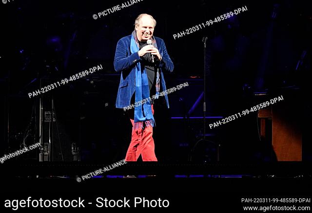 11 March 2022, Hamburg: German film composer Hans Zimmer welcomes the audience on stage at Barclays Arena. Oscar winner Zimmer has started his ""Hans Zimmer...