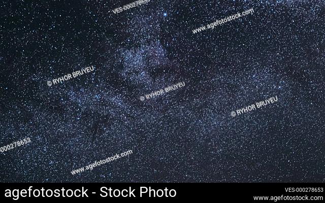 Night Starry Sky With Glowing Stars. Bright Glow Of Sky Stars And Milky Way Galaxy. 4K. Natural Background Backdrop