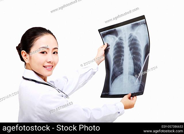 The young female doctor checking X ray film high quality photo