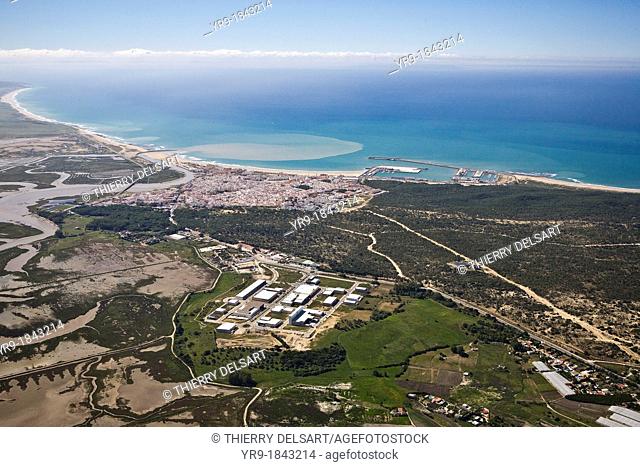 Barbate de Franco Cádiz, Spain Aerial view  The city and its little harbour  The river mouth throw browny water into the sea  Salt lakes on the left  Tanger...