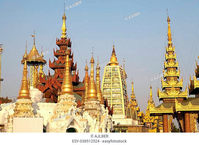 Pagodas at the Shwedagon Pagoda, a gilded stupa located in Yangon, Myanmar. The 99 metres tall pagoda is situated on Singuttare Hill