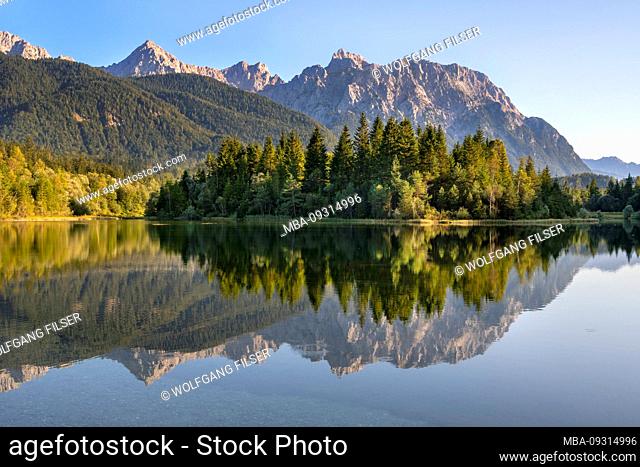 Karwendelgebirge with reflection in the Isar Reservoir near Krün