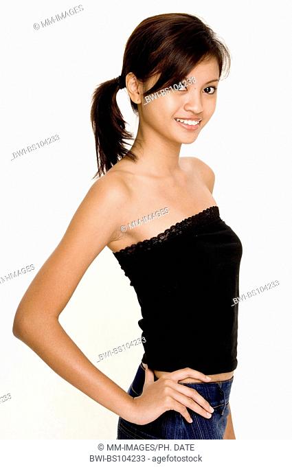 A cute young asian woman in casual clothes on white
