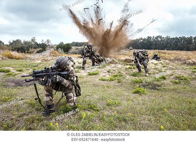 Squad of elite french paratroopers of 1st Marine Infantry Parachute Regiment RPIMA ambushed in action, landmine exploding