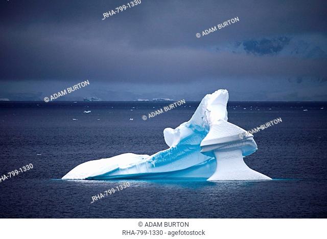 Water sculpted iceberg adrift off the Antarctic Peninsula, Antarctica, Polar Regions