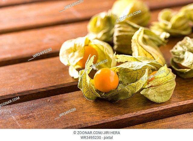 Physalis peruviana fruit on wooden table