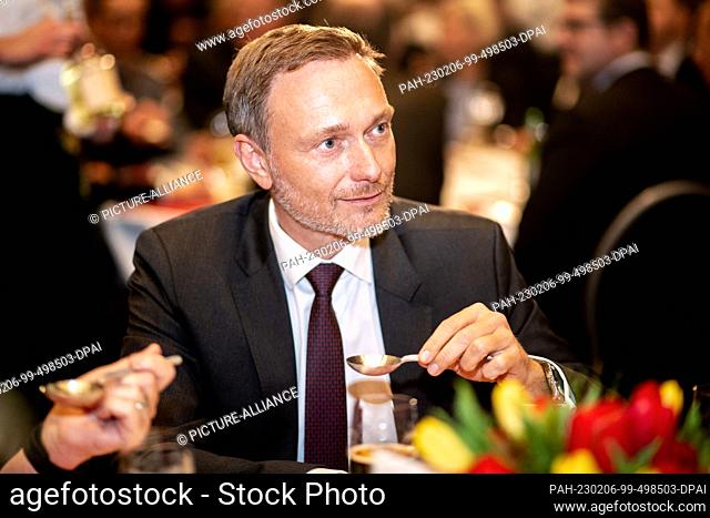 06 February 2023, Berlin: The new Oldenburg Kale King Christian Lindner (FDP), Federal Minister of Finance, holds an Ammerland spoon drink in his hands at the...