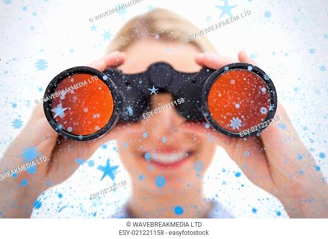 Composite image of woman looking through binoculars