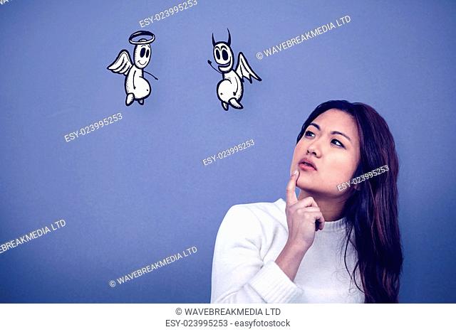 Thoughtful Asian woman with finger on chin against blue background