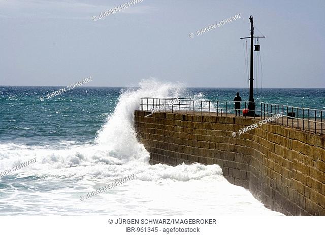 Surf on Porthleven harbour wall, Cornwall, Great Britain, Europe