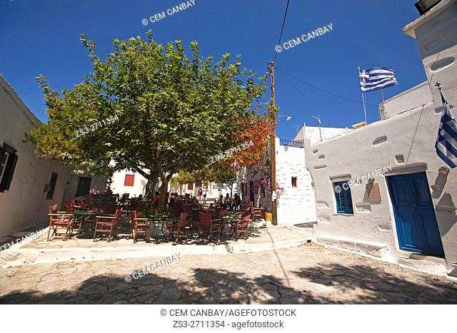 People sitting in an open-air cafe at the old town Chora, Amorgos, Cyclades Islands, Greek Islands, Greece, Europe