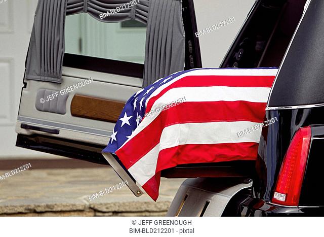 American flag over casket at military funeral