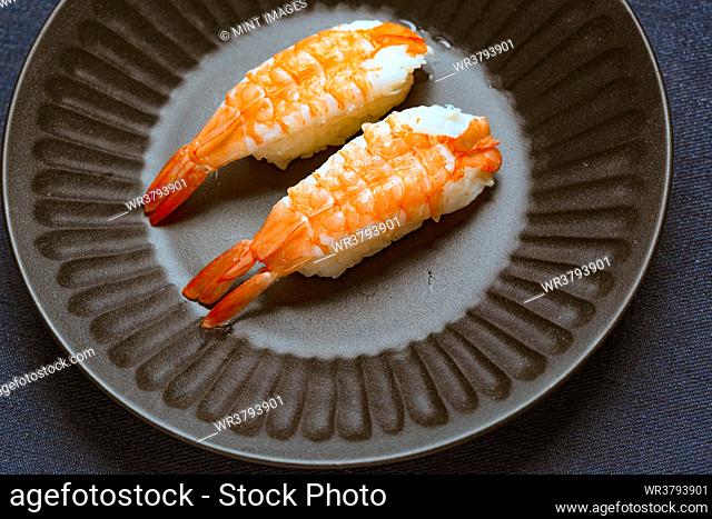 Prawns and rice on a blue dish