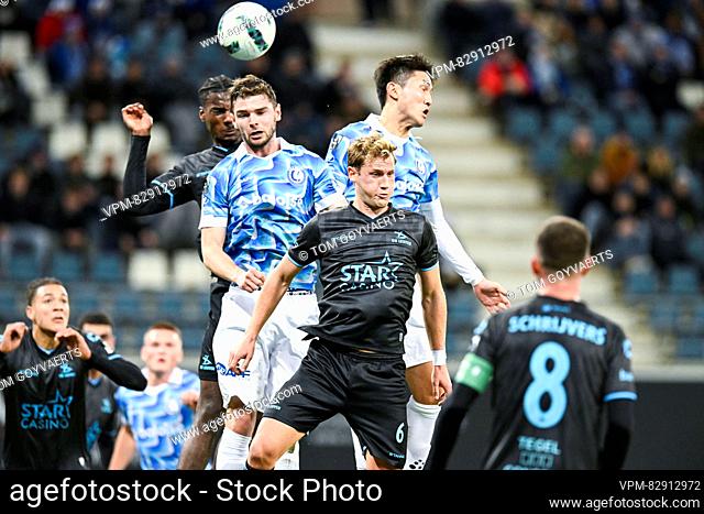 Gent's Hugo Cuypers, Gent's Tsuyoshi Watanabe and OHL's Joren Dom pictured in action during a soccer match between KAA Gent and OH Leuven