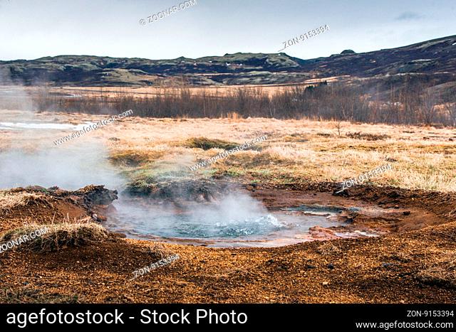 Geothermal puddle with boiling water in Iceland
