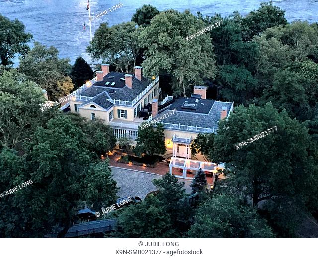 New York City, Manhattan. Overlooking Gracie Mansion, the home of the Mayor of New York City, on the East River, Adjacent to Carl Schurz Park, at Twilight