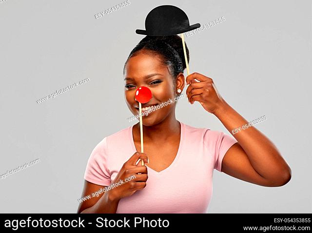 happy african american woman with red clown nose