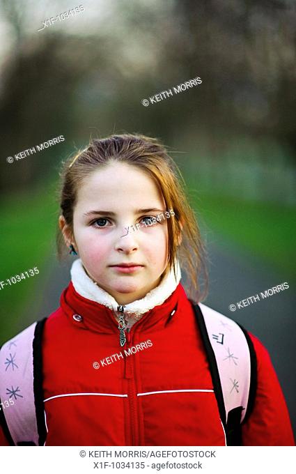 Ten year old girl, looking straight ahead, UK