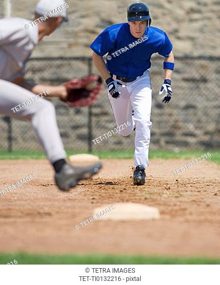 Baseball player trying to steal base
