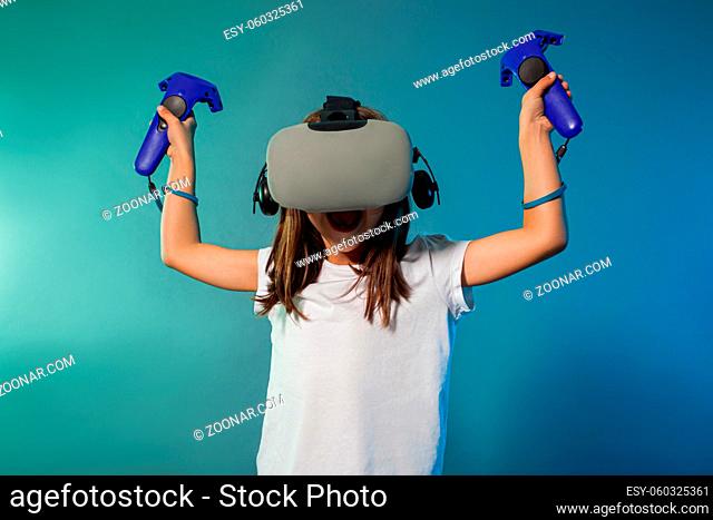 Teenager girl using a gaming gadget for virtual reality. Augmented reality, mock up